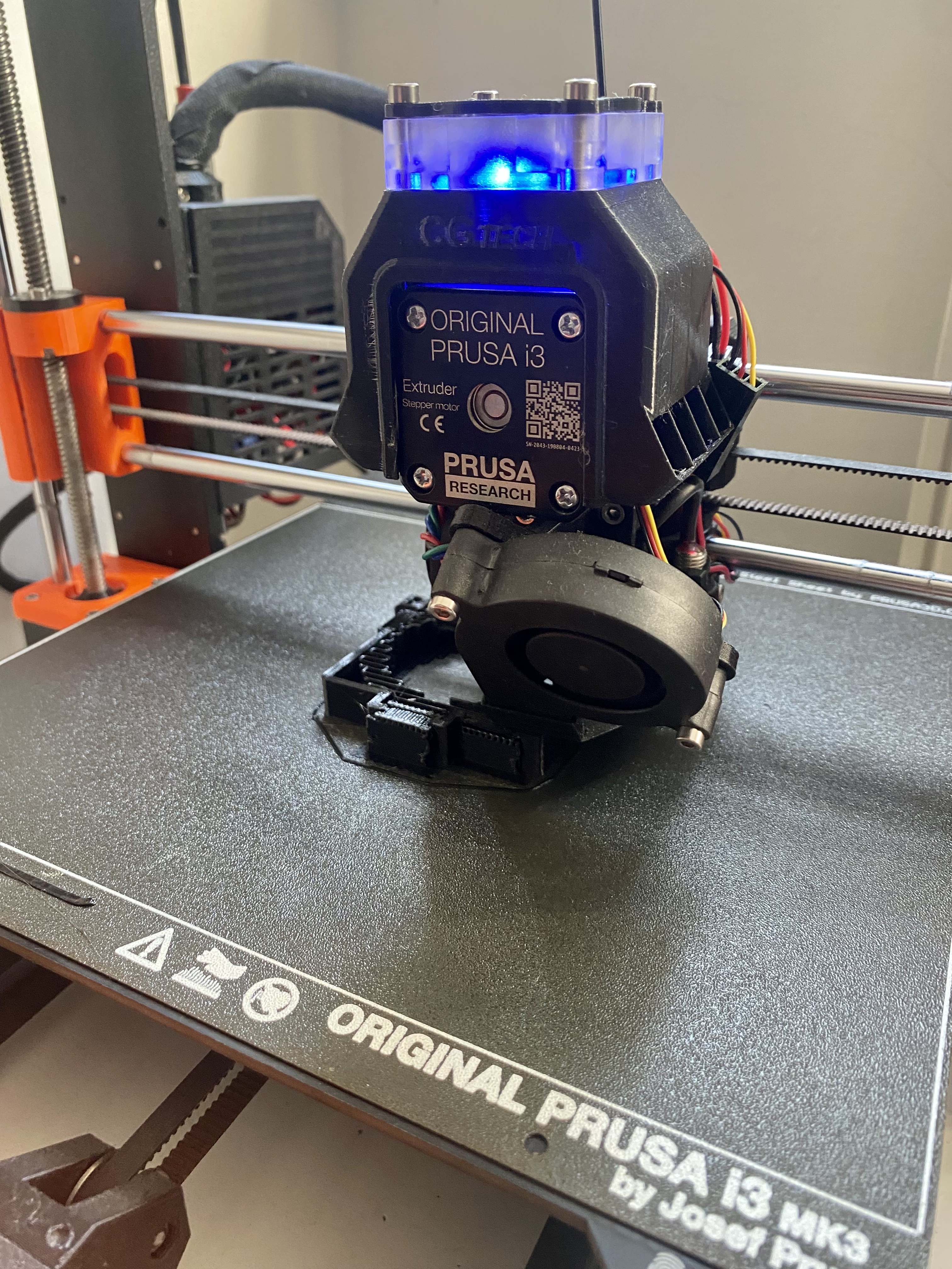 A picture of an adapter being printed by my 3D printer