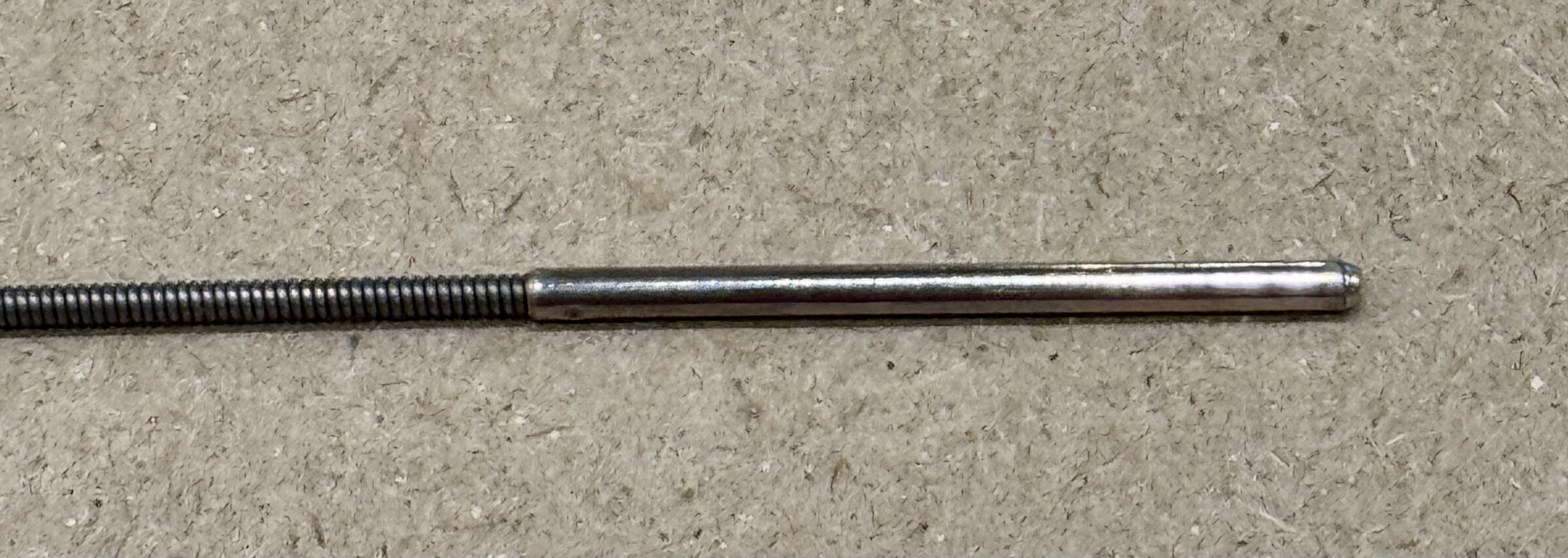 The force spring and pin from a generic cable.